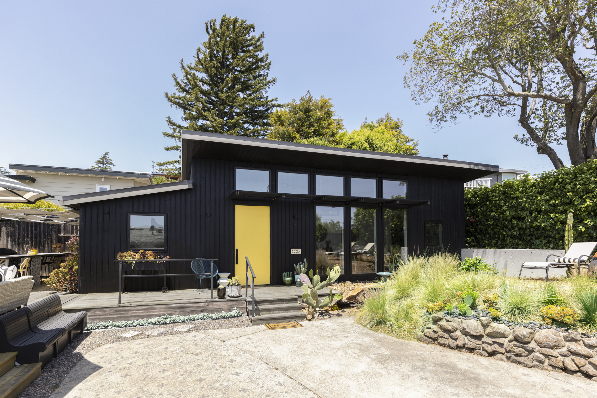 Canyon Design Build created this Corte Madera, CA ADU as a private, accessible living space for an aging parent—complete with a full kitchen, vaulted ceilings, warm mid-century style, and a shared deck that connects the family while honoring independence.