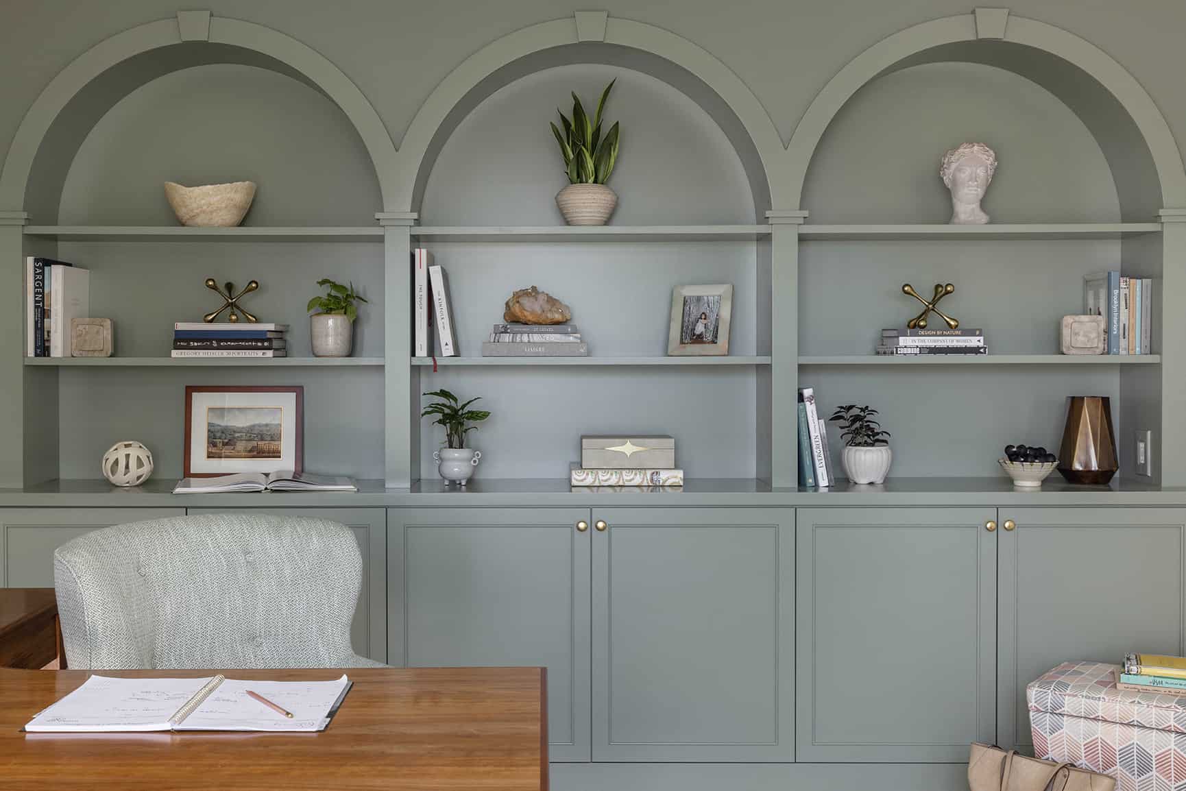 Beautifully crafted built-in arched cabinets.