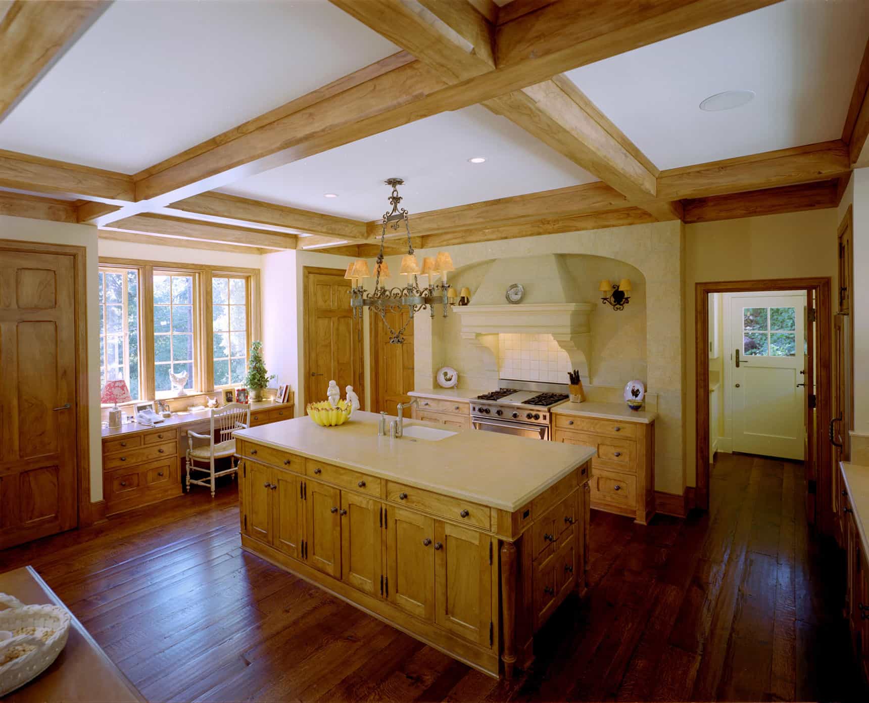 Historic kitchen renovation with exposed beams across the ceilings.