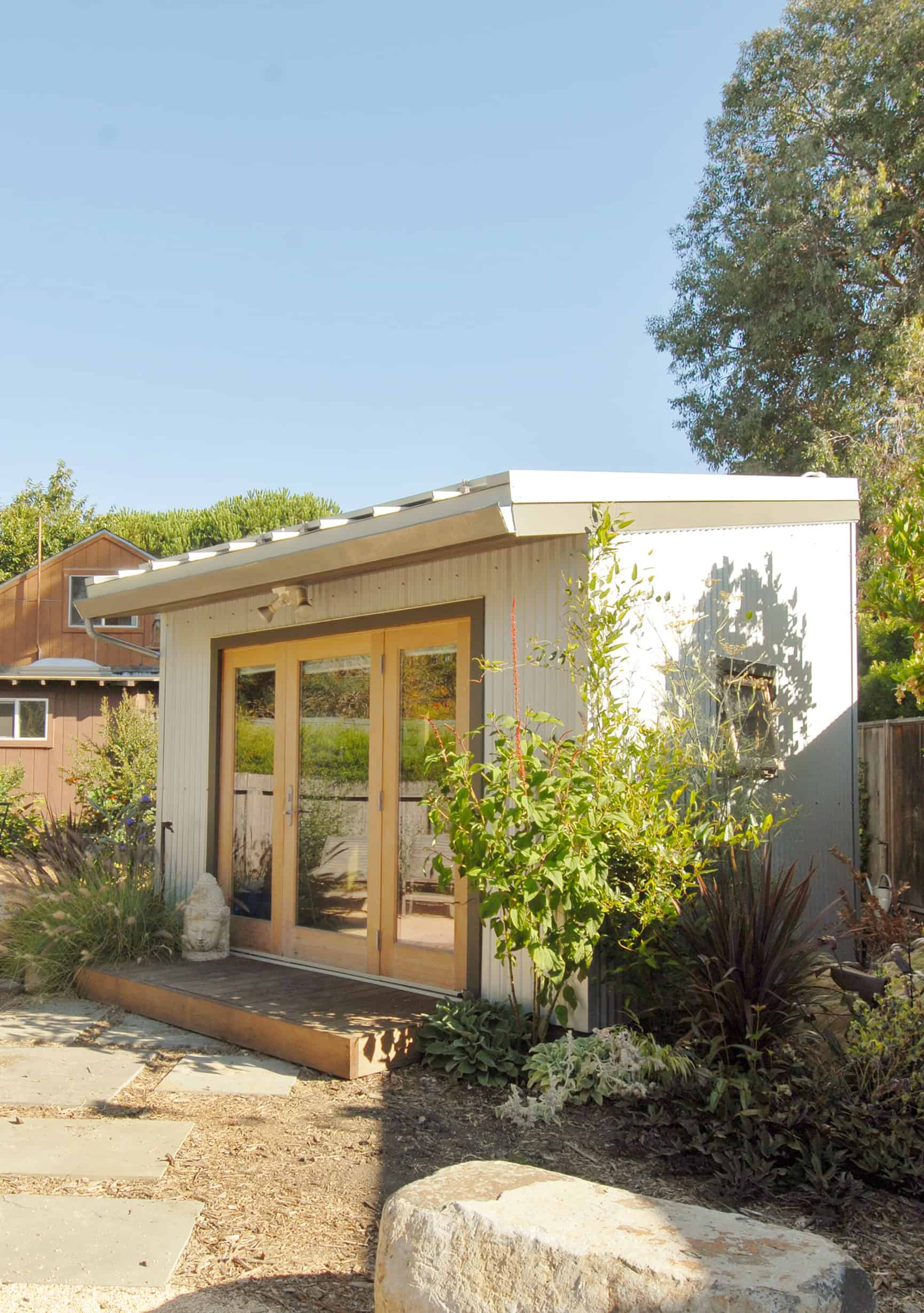 Accessory Dwelling Unit in a backyard with glass doors.