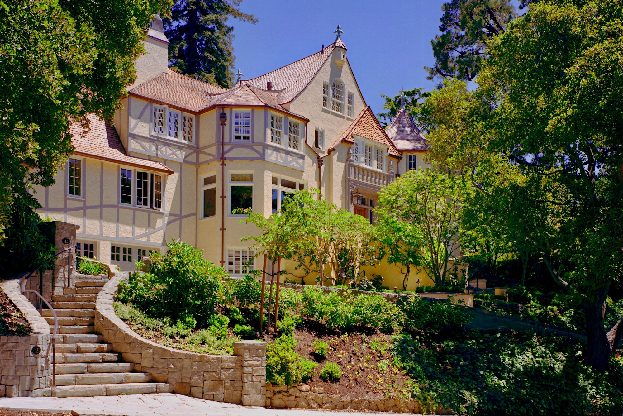 Historic storybook-style home originally designed by architect William Yelland, showing restored structural elements and preserved architectural details after a full renovation that blends modern upgrades with the home’s original character.
