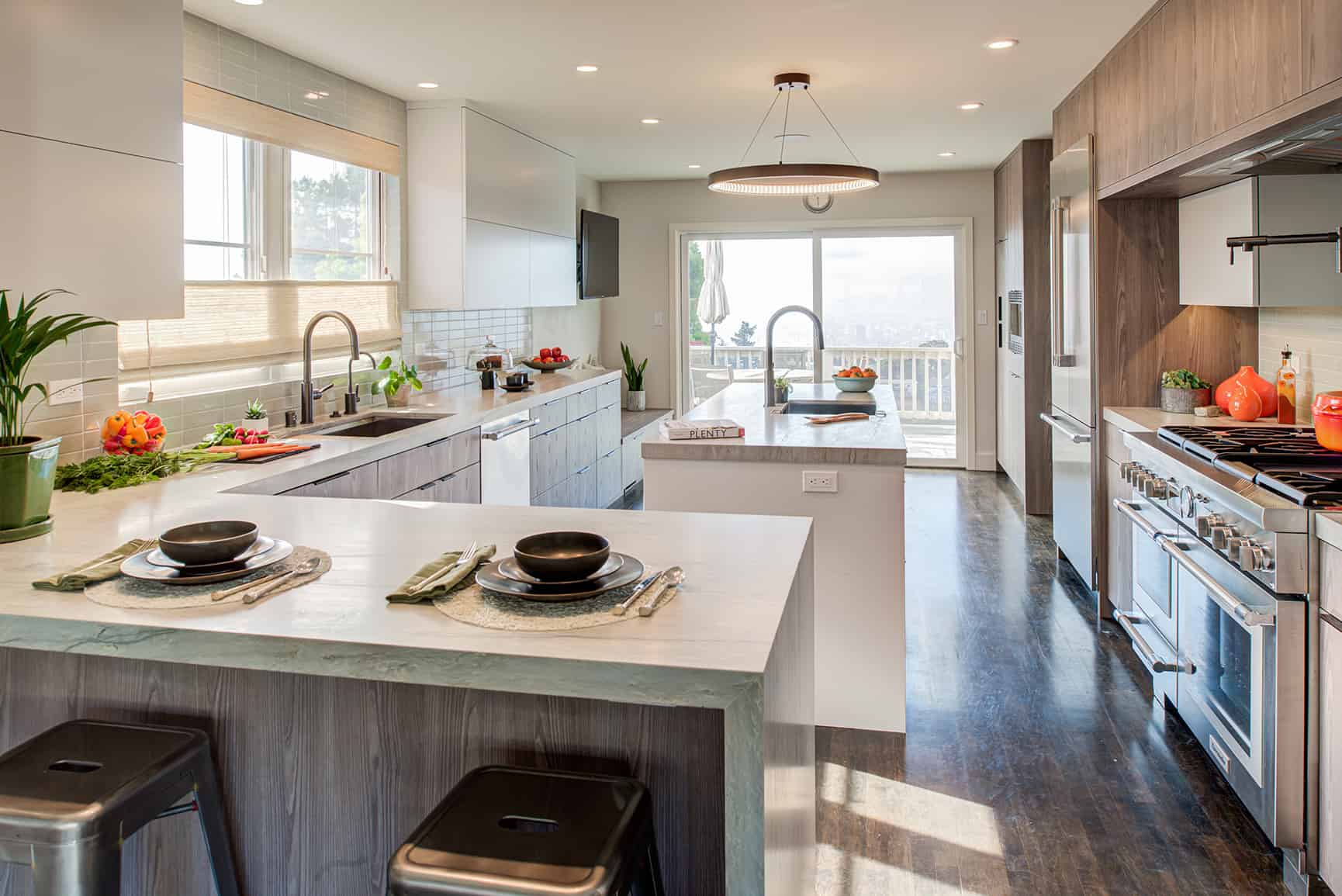 Modern kitchen remodel with dark hardwood floors.