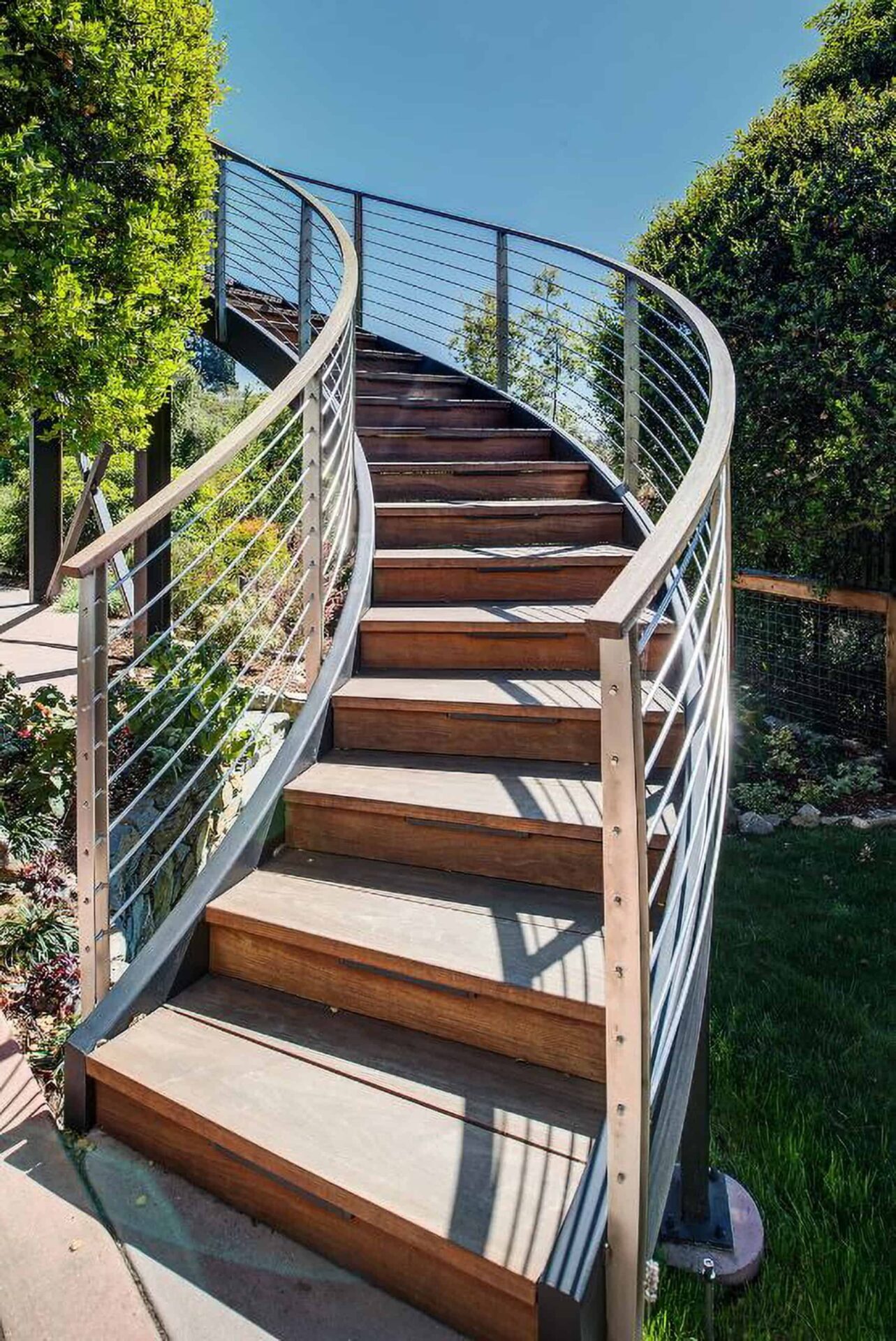 Curved staircase leading to a deck.