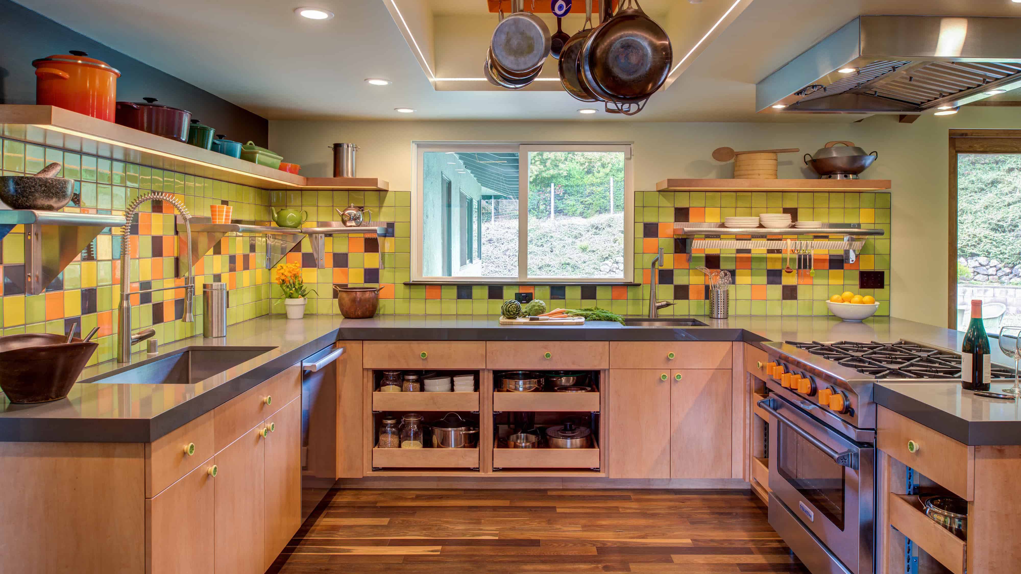 Retro kitchen remodel with colorful backsplash tiles.