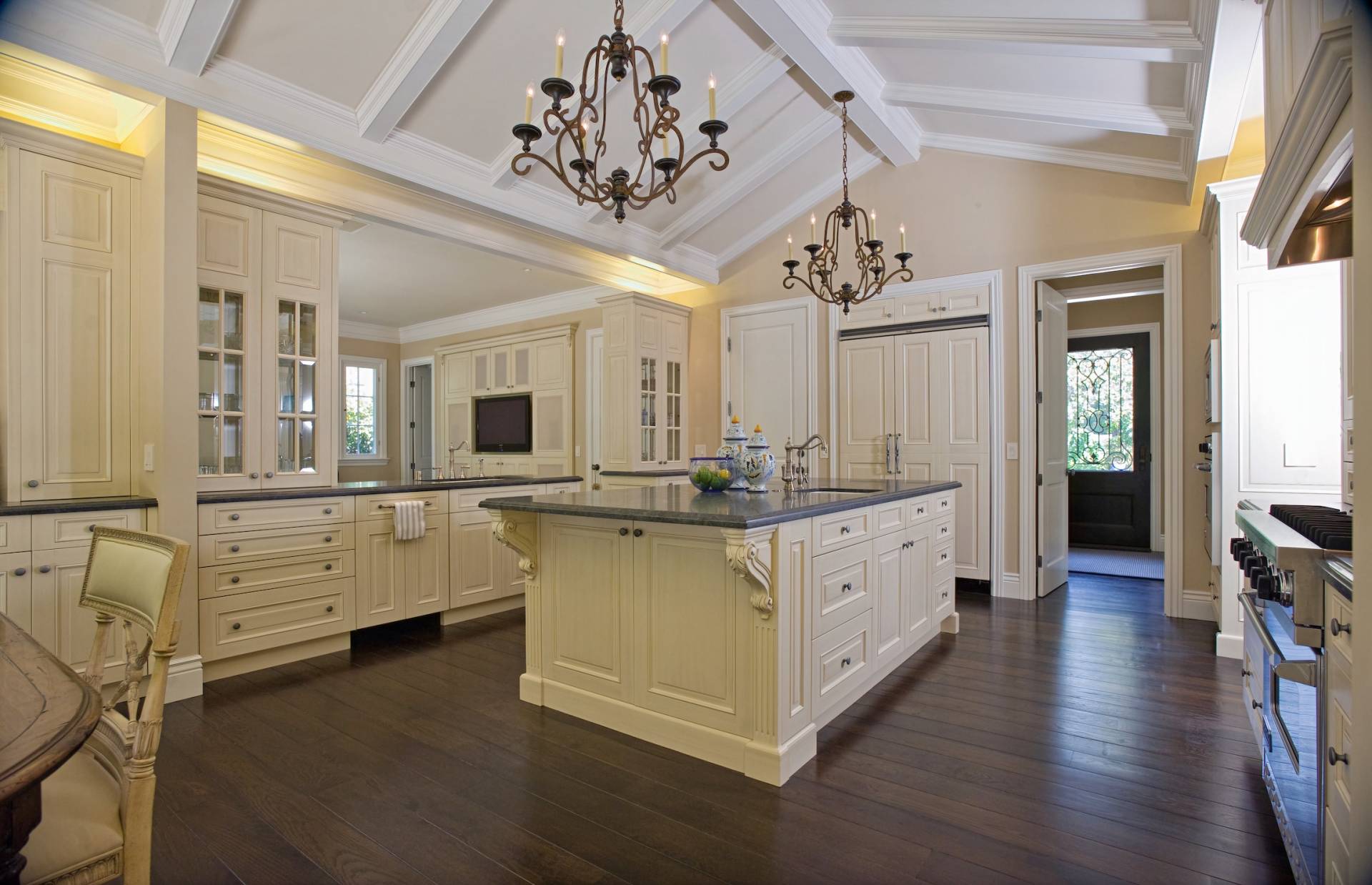 Full-home remodel by Canyon Design Build in Piedmont, CA blends classic French-inspired kitchen design with modern function, indoor-outdoor flow, and refined curb appeal across updated living spaces.