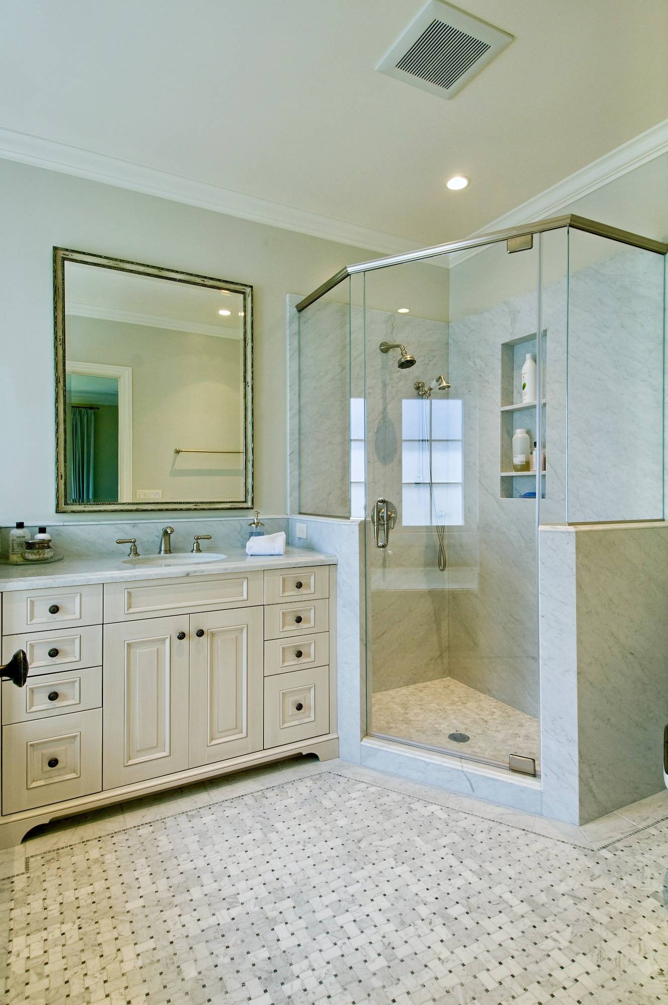 Full-home remodel by Canyon Design Build in Piedmont, CA blends classic French-inspired kitchen design with modern function, indoor-outdoor flow, and refined curb appeal across updated living spaces.