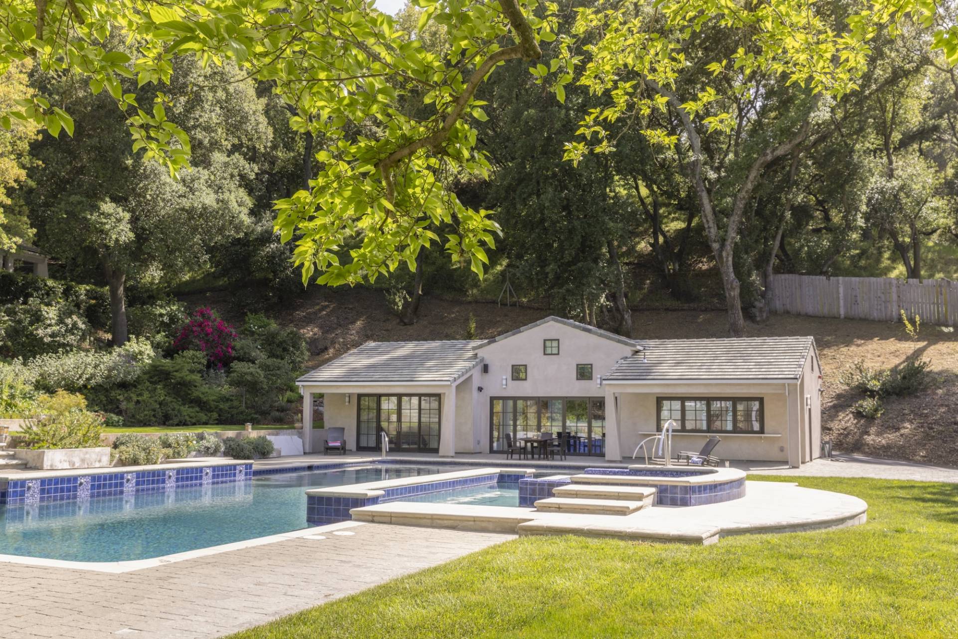 Lafayette, CA Pool House and ADU designed and built by Canyon Design Build. Featuring strong indoor/outdoor connection with master suite, fully equipped kitchen, outdoor shower, and renovated pool area. 