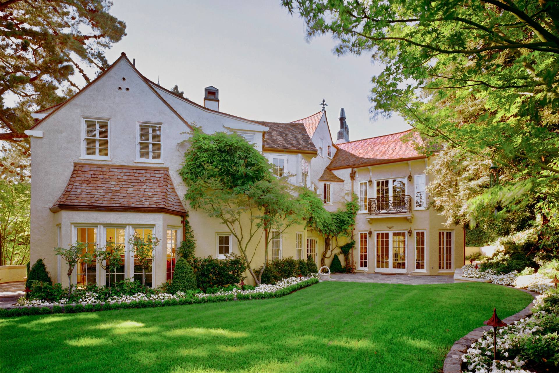 historic storybook-style home originally designed by architect William Yelland, showing restored structural elements and preserved architectural details after a full renovation that blends modern upgrades with the home’s original character.