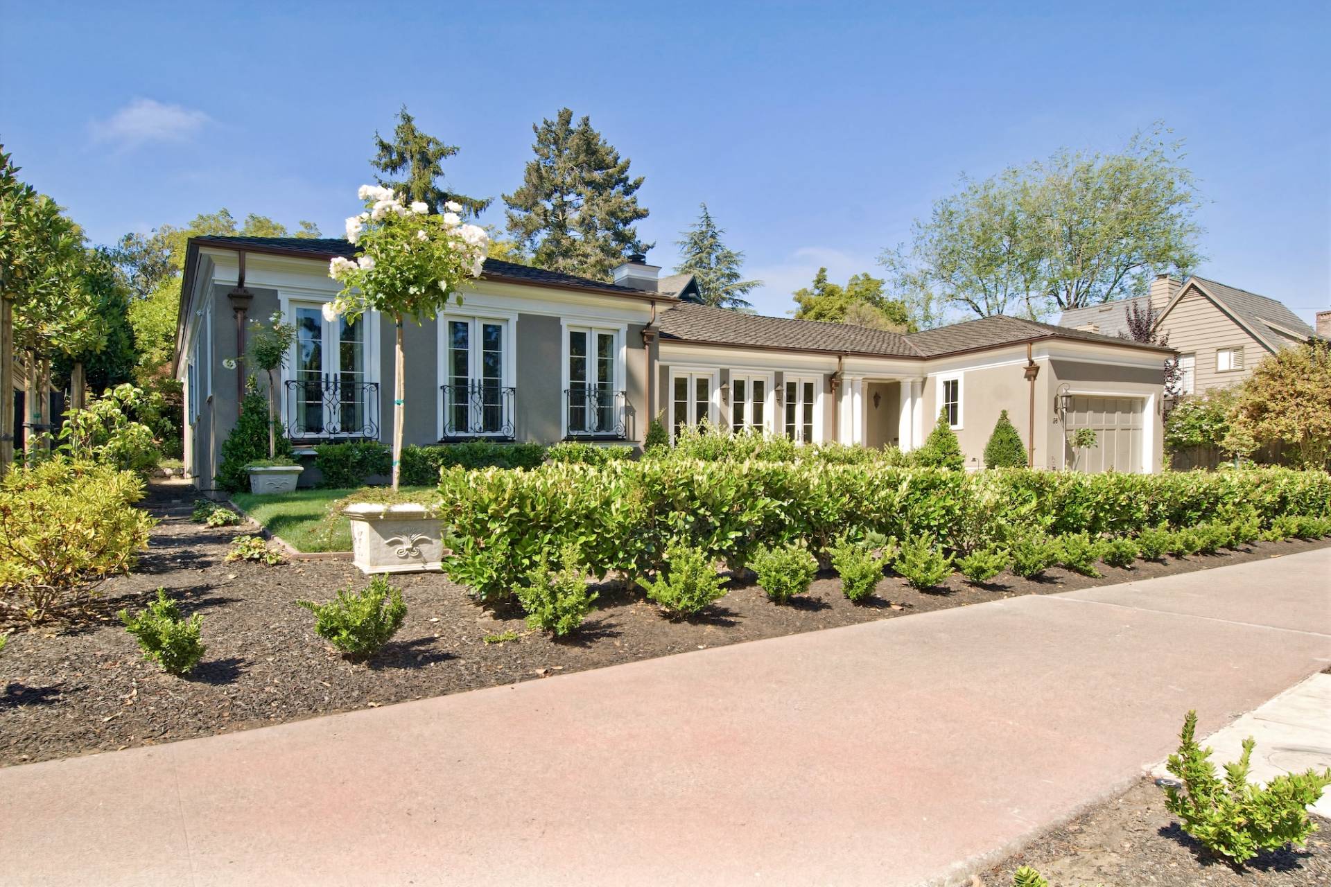 Full-home remodel by Canyon Design Build in Piedmont, CA blends classic French-inspired kitchen design with modern function, indoor-outdoor flow, and refined curb appeal across updated living spaces.