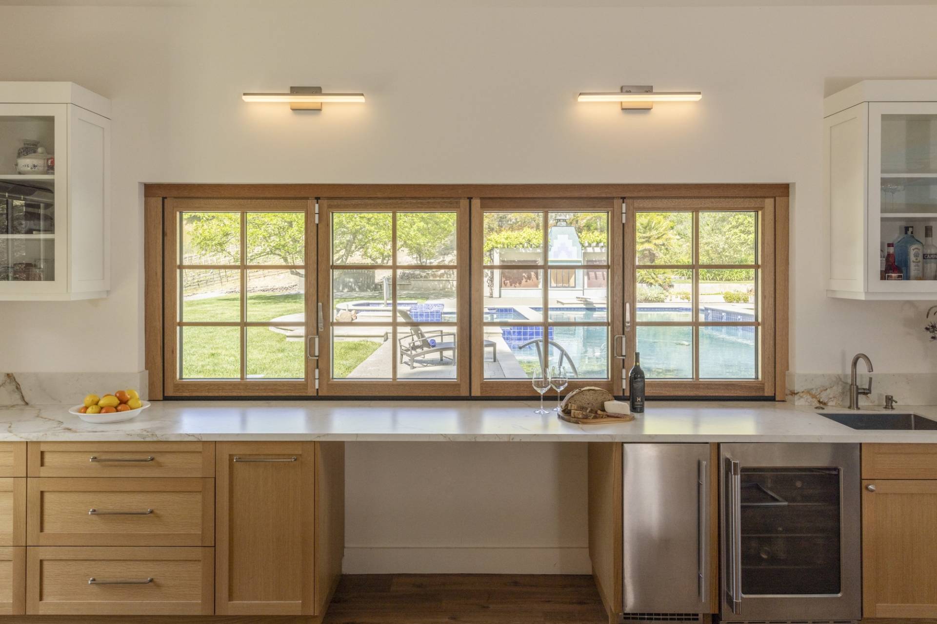 Lafayette, CA Pool House and ADU designed and built by Canyon Design Build. Featuring strong indoor/outdoor connection with master suite, fully equipped kitchen, outdoor shower, and renovated pool area. 