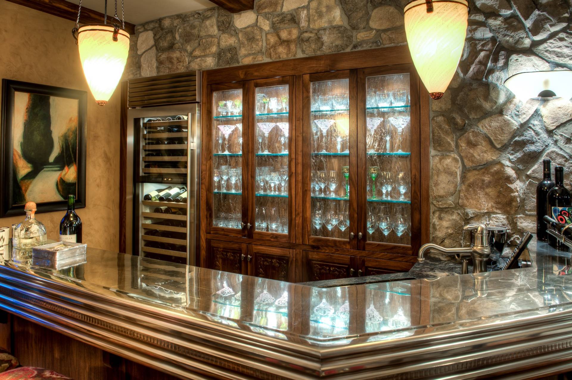 Custom built-in glass display in at-home bar by Canyon Design Build in Danville, CA home remodel.