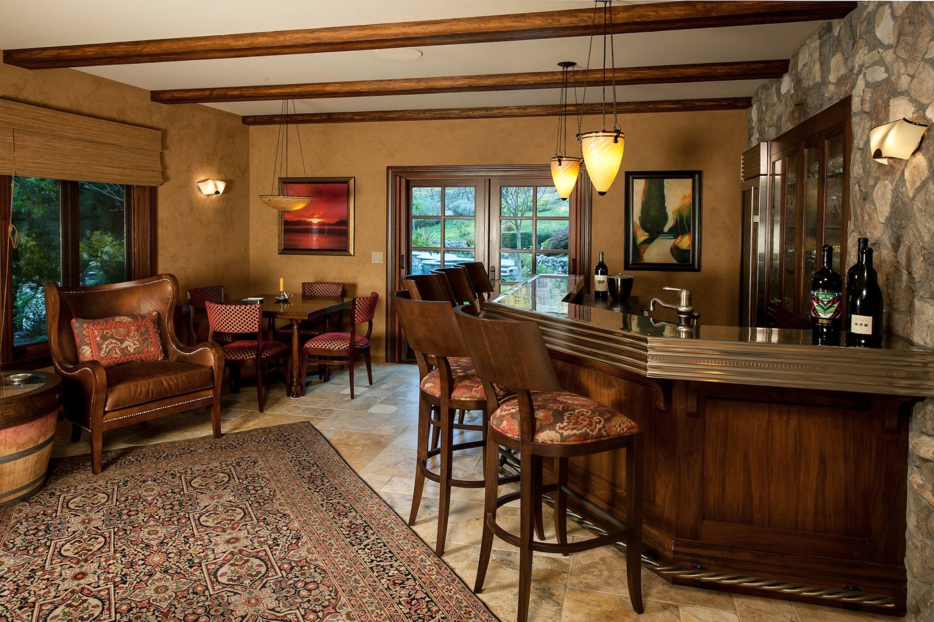 Custom built-in glass display and bar in at-home bar by Canyon Design Build in Danville, CA home remodel.