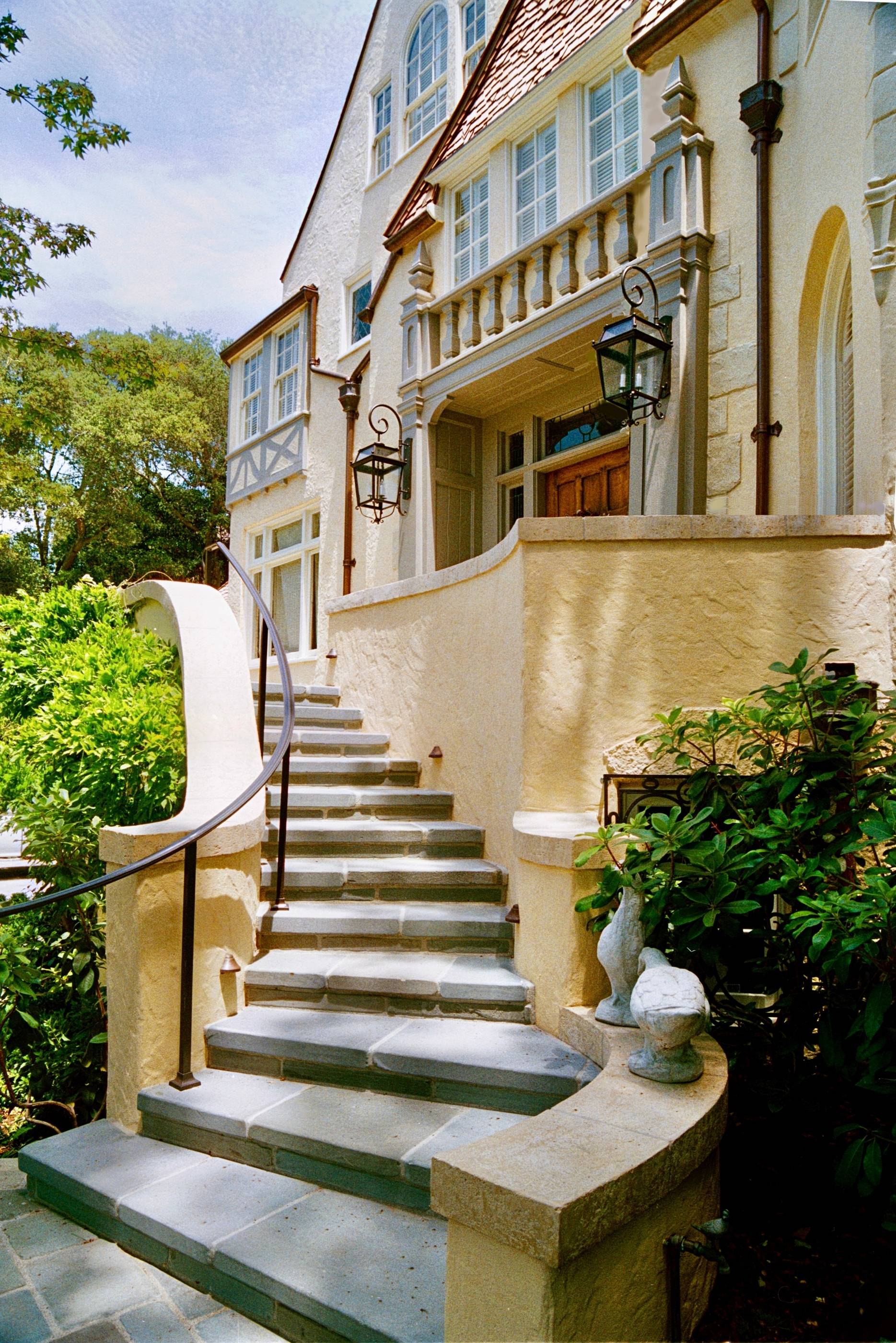 historic storybook-style home originally designed by architect William Yelland, showing restored structural elements and preserved architectural details after a full renovation that blends modern upgrades with the home’s original character.